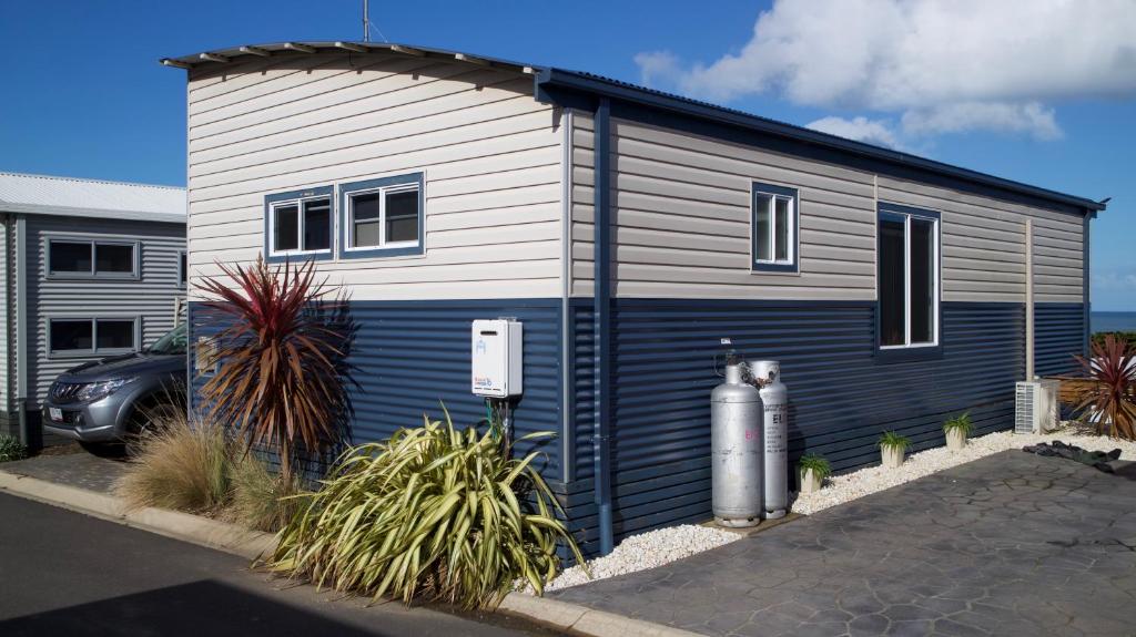 a small house with a blue and white at Iconic Luxury & Ocean Views in Apollo Bay