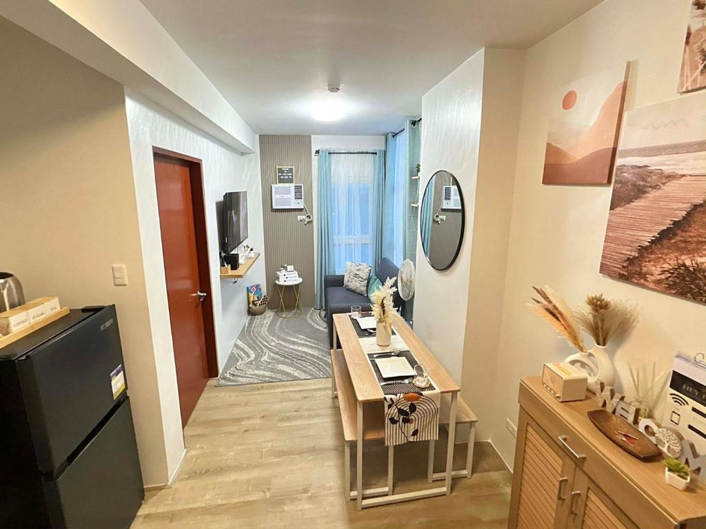a small apartment with a kitchen and a living room at H4R1 Luxe Haven in Bacolod