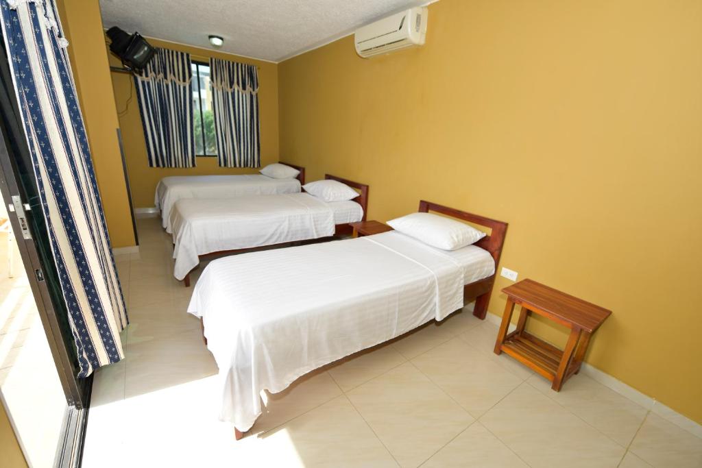 Postel nebo postele na pokoji v ubytování Hotel La Aldea