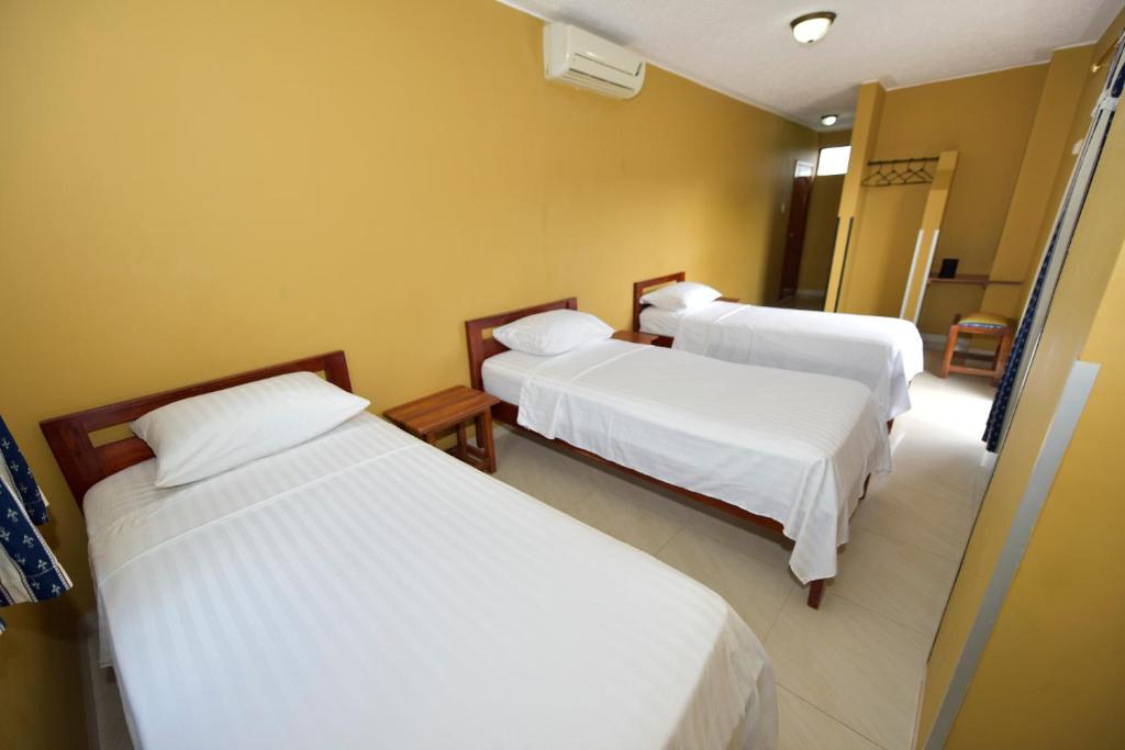 Postel nebo postele na pokoji v ubytování Hotel La Aldea