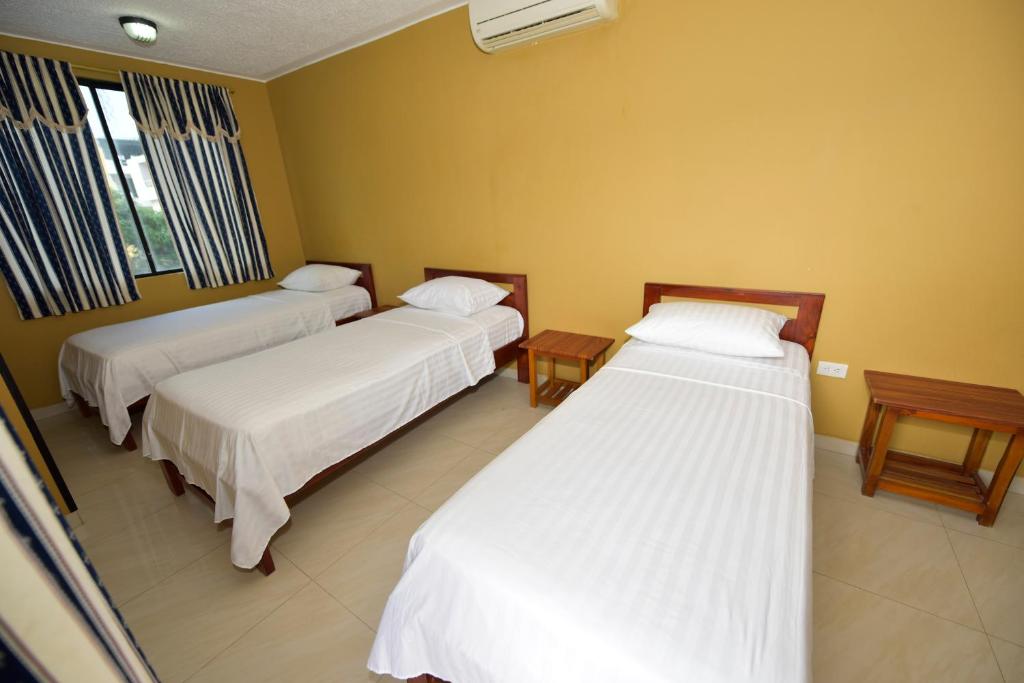 Postel nebo postele na pokoji v ubytování Hotel La Aldea