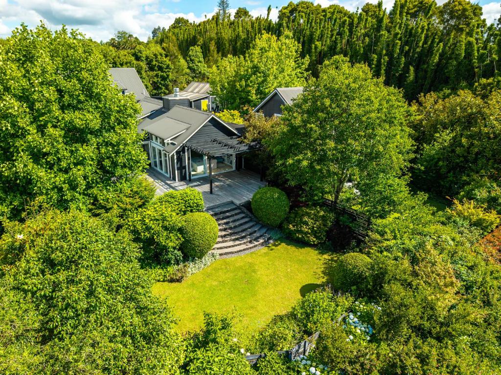 an aerial view of a house with a yard at Treghan Luxury Lodge in Kerikeri