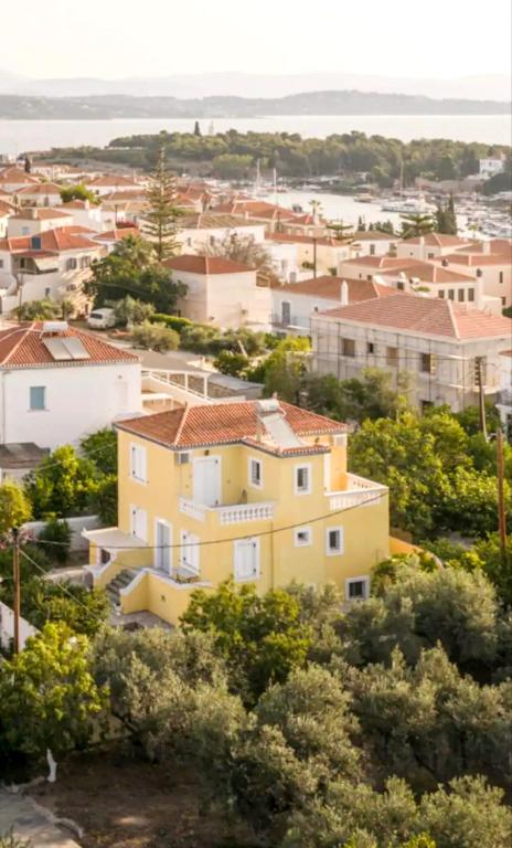 a view of a town with houses and the ocean at Villa Santa Marina in Spetses