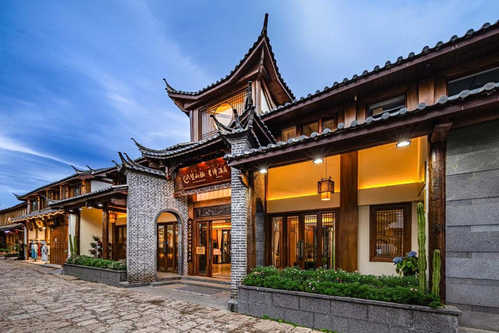 a row of buildings on a street at MOUNT WELL RESORT HOTEL in Lijiang