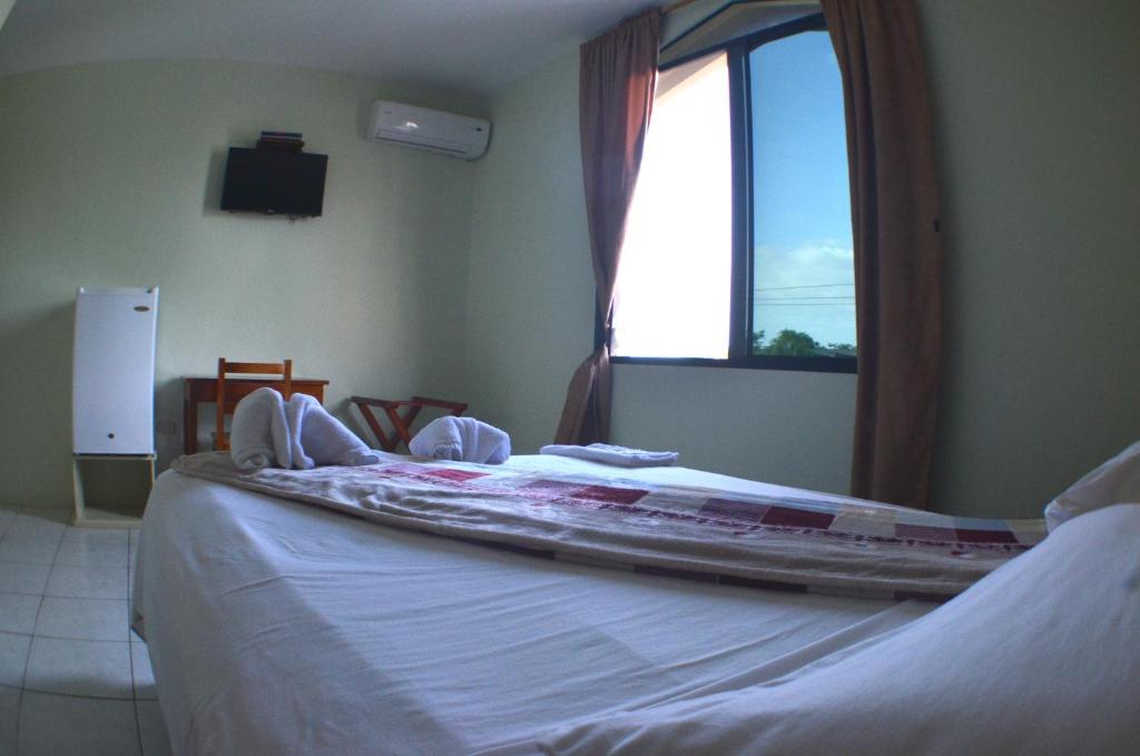 Postel nebo postele na pokoji v ubytování Hostal Andry