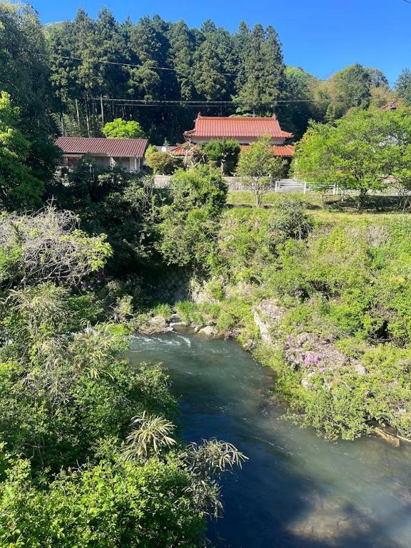 an aerial view of a river in a field at かんぬしの宿 in Yamaguchi
