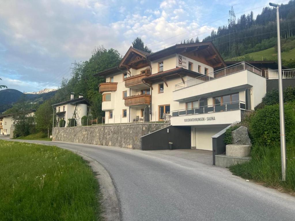 a house on the side of a road at Apartment with Alpine views in Fügenberg
