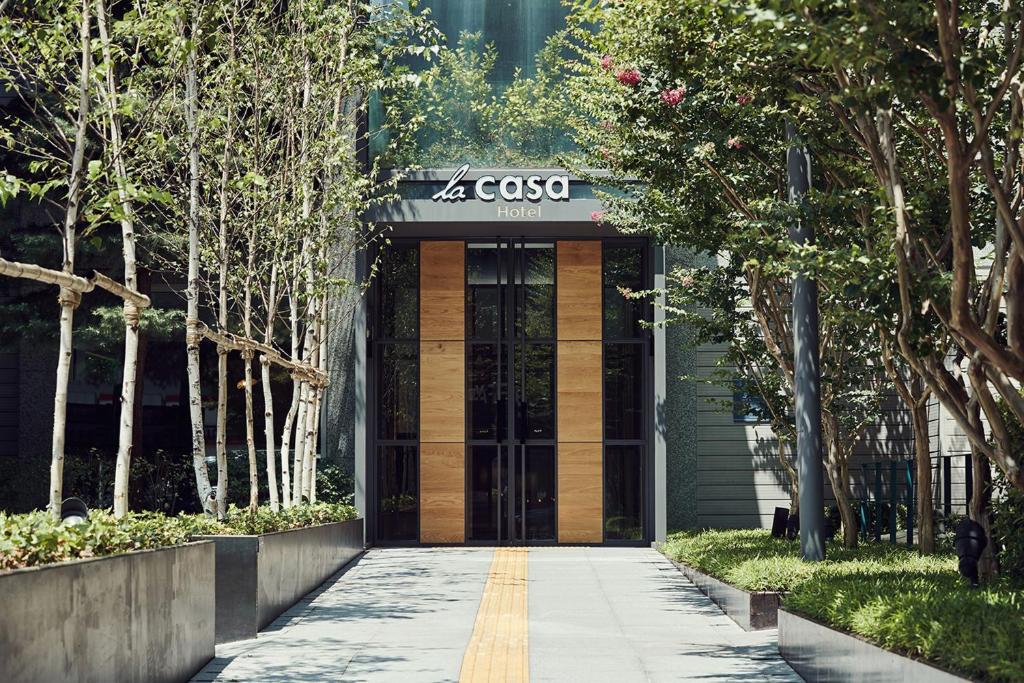 a entrance to a building with a cisco sign on it at La Casa Hotel Seoul in Seoul