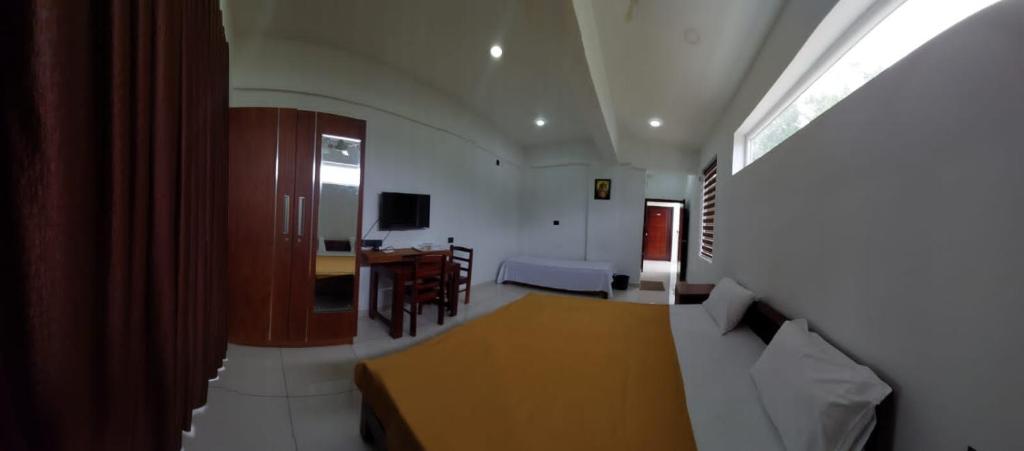 a living room with a couch and a table at Devi Royal Residency in Mararikulam