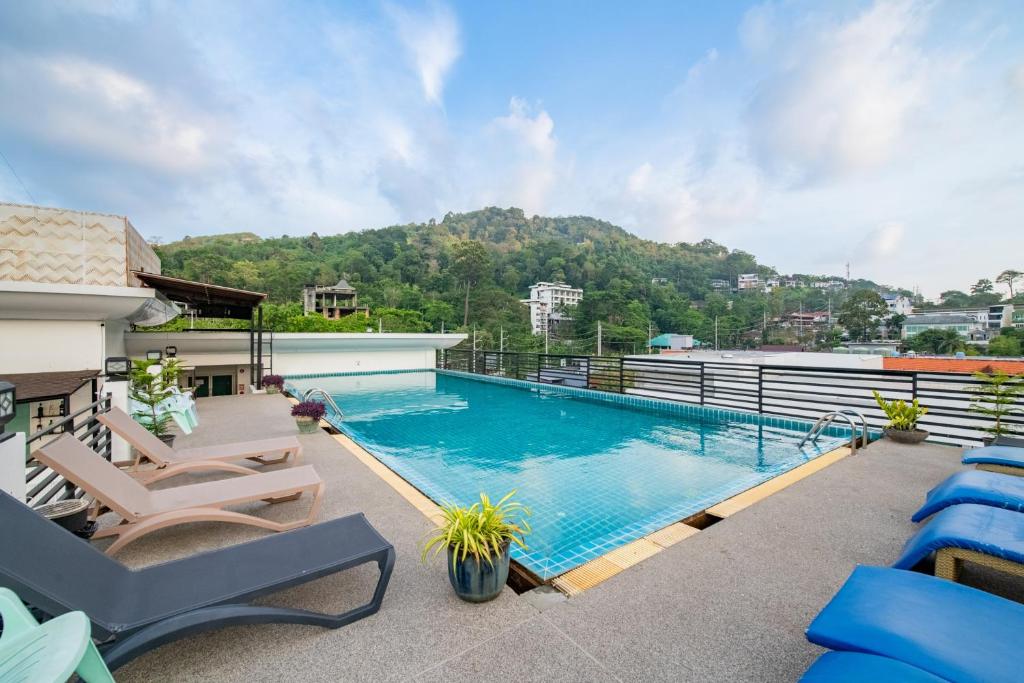 a swimming pool on the roof of a house at The Kris Resort Hotel in Patong Beach