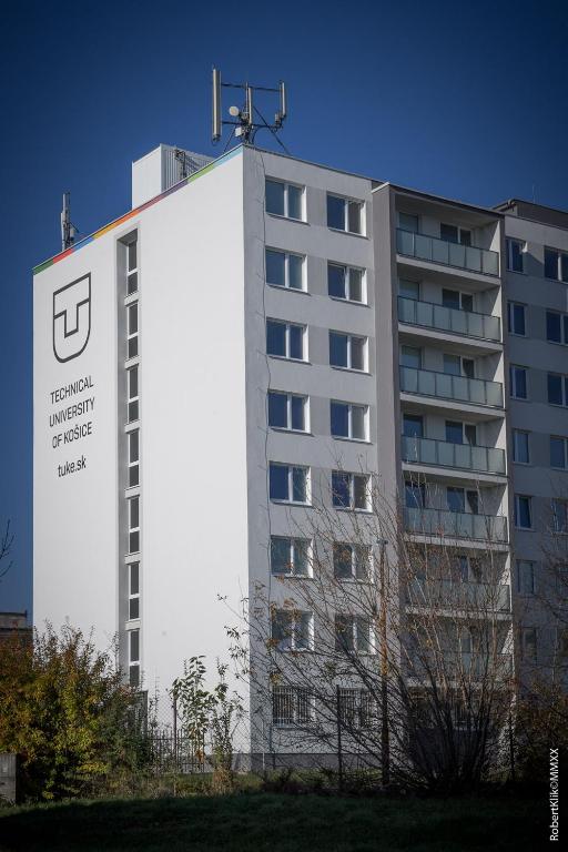 a building with a sign on the side of it at ŠD Jedlíkova 9 in Košice