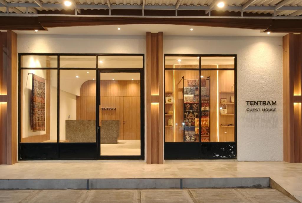 a store front with glass doors in a building at Tentram Guest House in Waikabubak