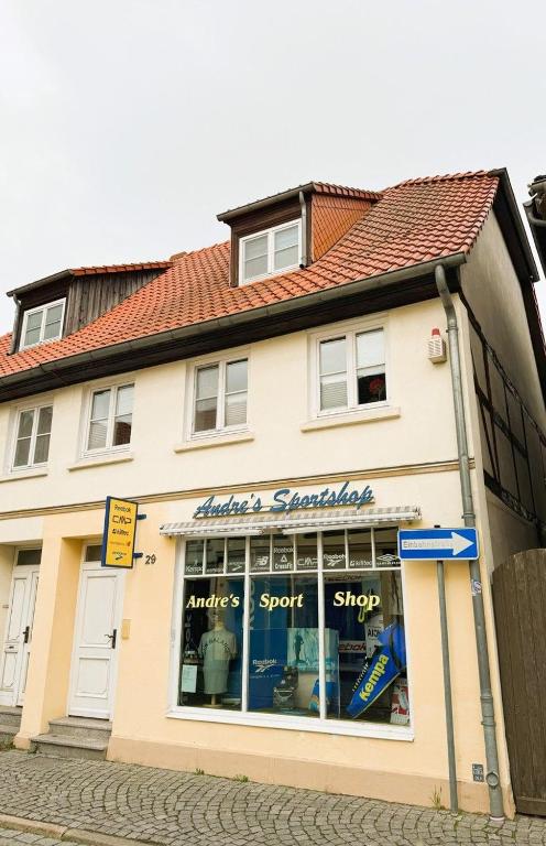 a store on the side of a building at Inseldomizil - Melina in Malchow