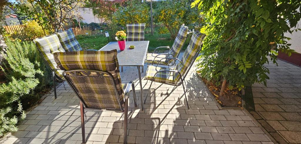 a group of chairs sitting around a table at Ferienhaus Rosengarten in Blankenburg