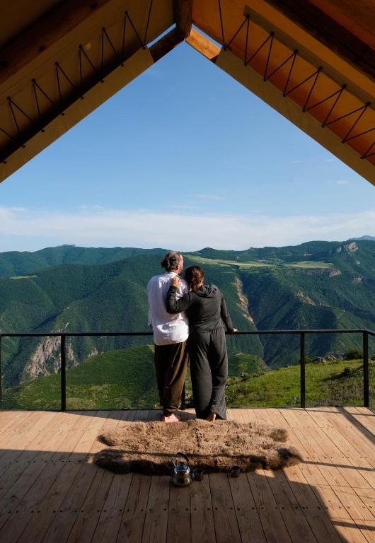 two people standing on the top of a mountain at Yagoda Moya in Khot