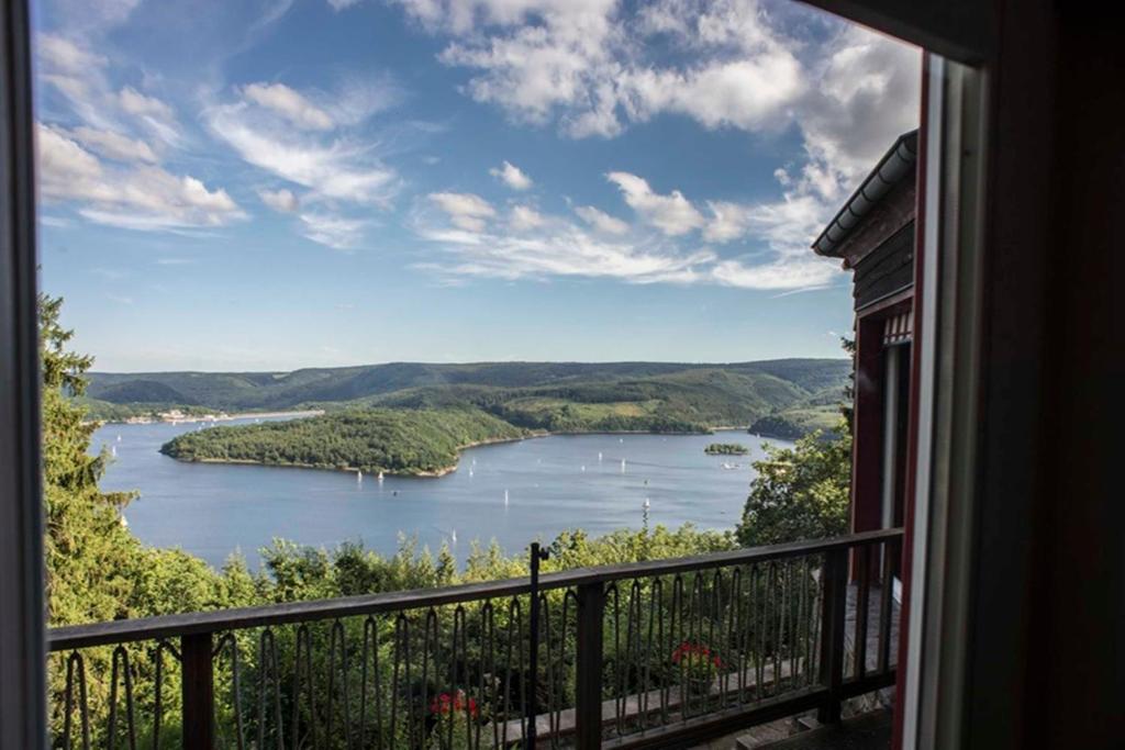 a view of a lake from a window at Waldhaus Anne in Simmerath
