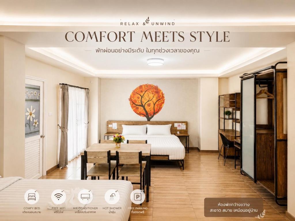 a hotel room with a bed and a dining table at Nangnon Hill Hug Hotel in Ban Pa Muat