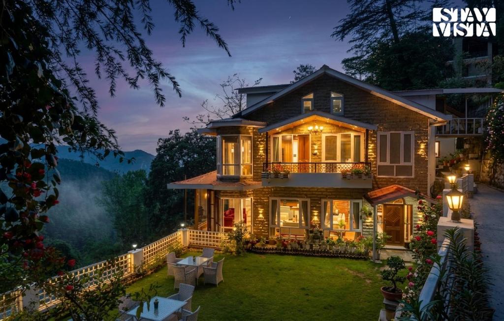a home with a view of the mountains at Simla Manor by VEO - Part of StayVista in Shimla