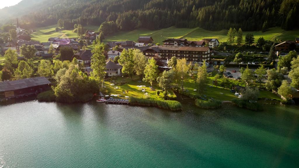 an aerial view of a resort next to a lake at LACUS Hotel am See in Weissensee