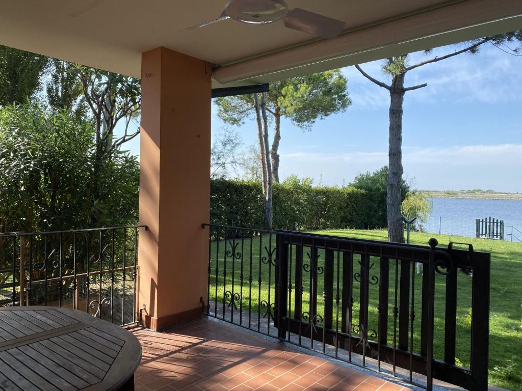 a balcony with a view of the water at April in Caleri