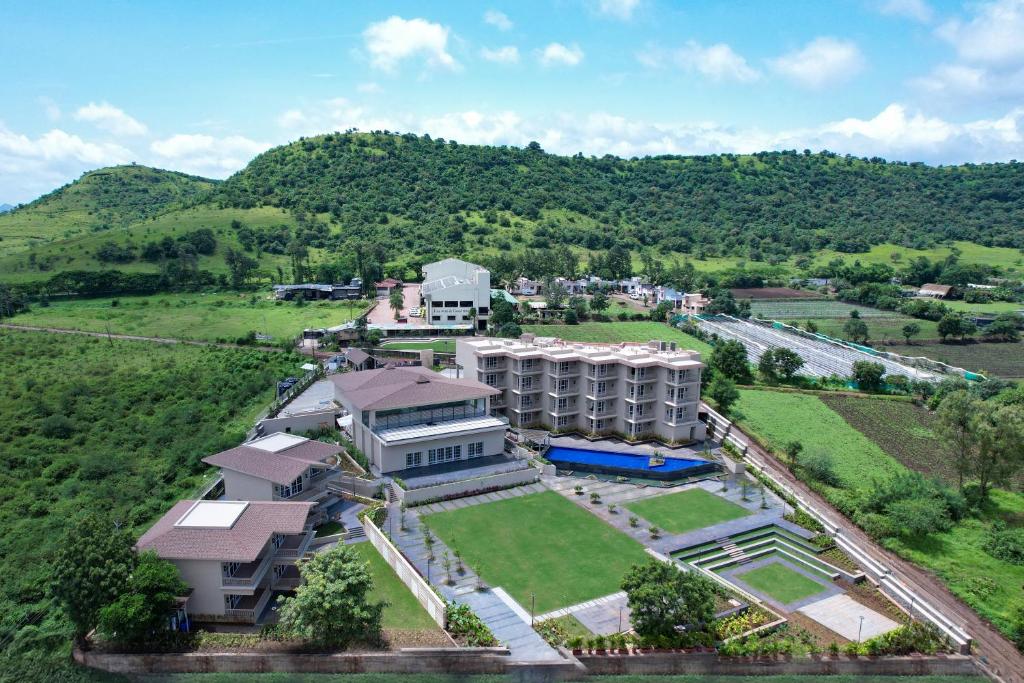 an aerial view of a building in a field at The Haven by Sula in Nashik