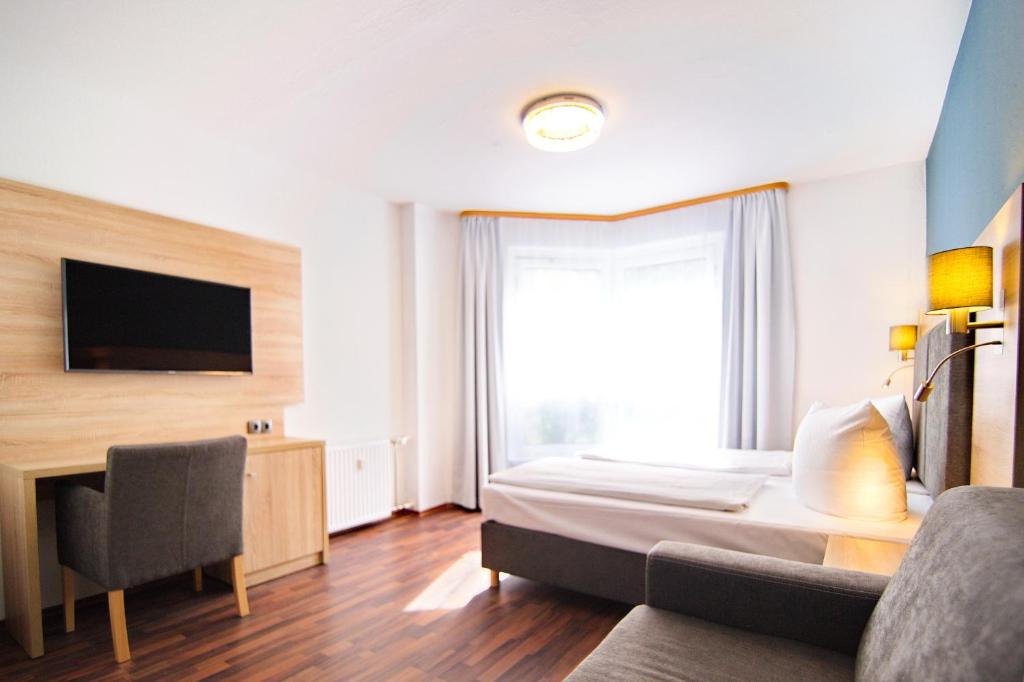TV a/nebo společenská místnost v ubytování BlnCty Hotel