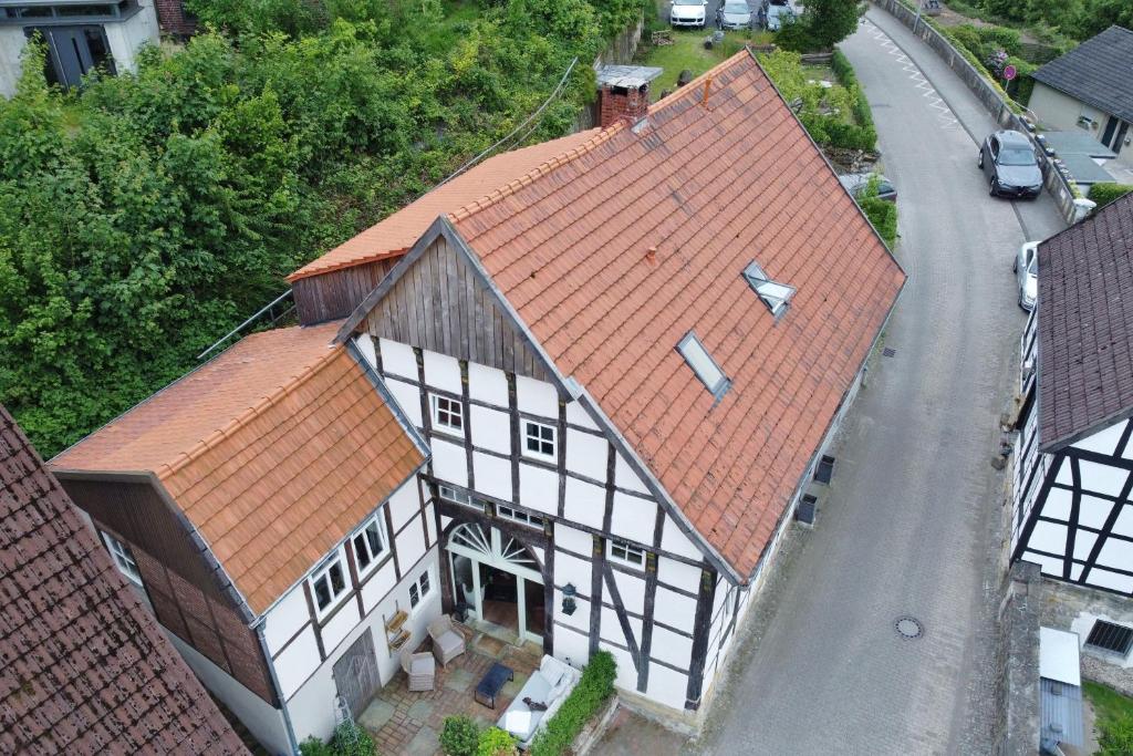an aerial view of a building with orange roofs at MispelFachwerkOase in Tecklenburg