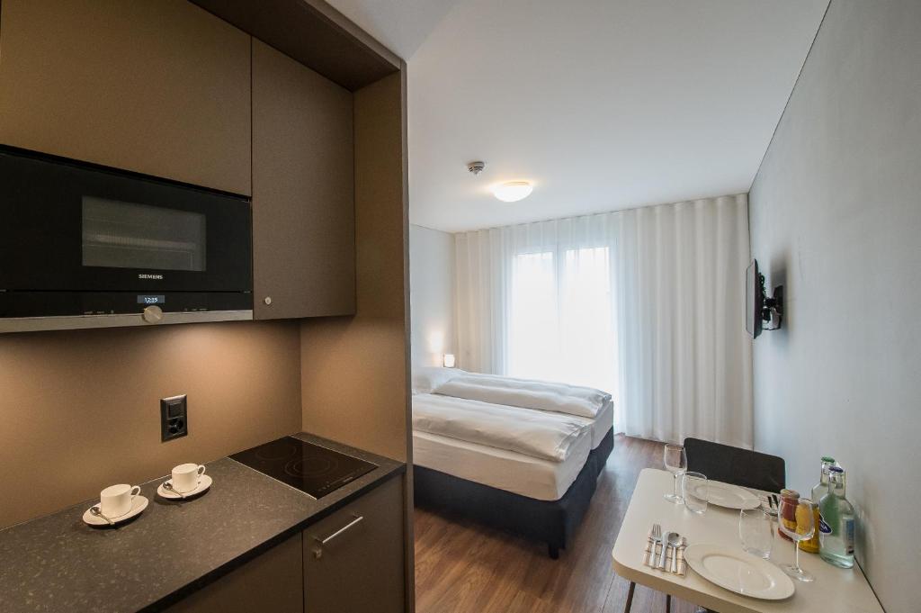 Postel nebo postele na pokoji v ubytování Aparthotel Baden