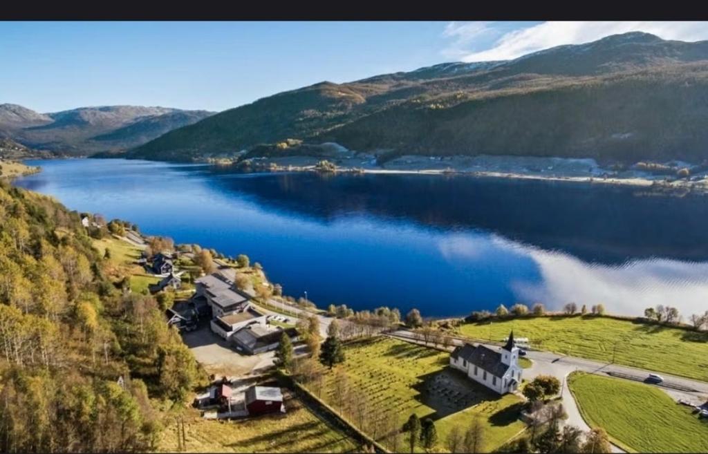 an aerial view of a lake with a group of campgrounds at Oppheim apartment, shared Pool & Sauna in Vossevangen