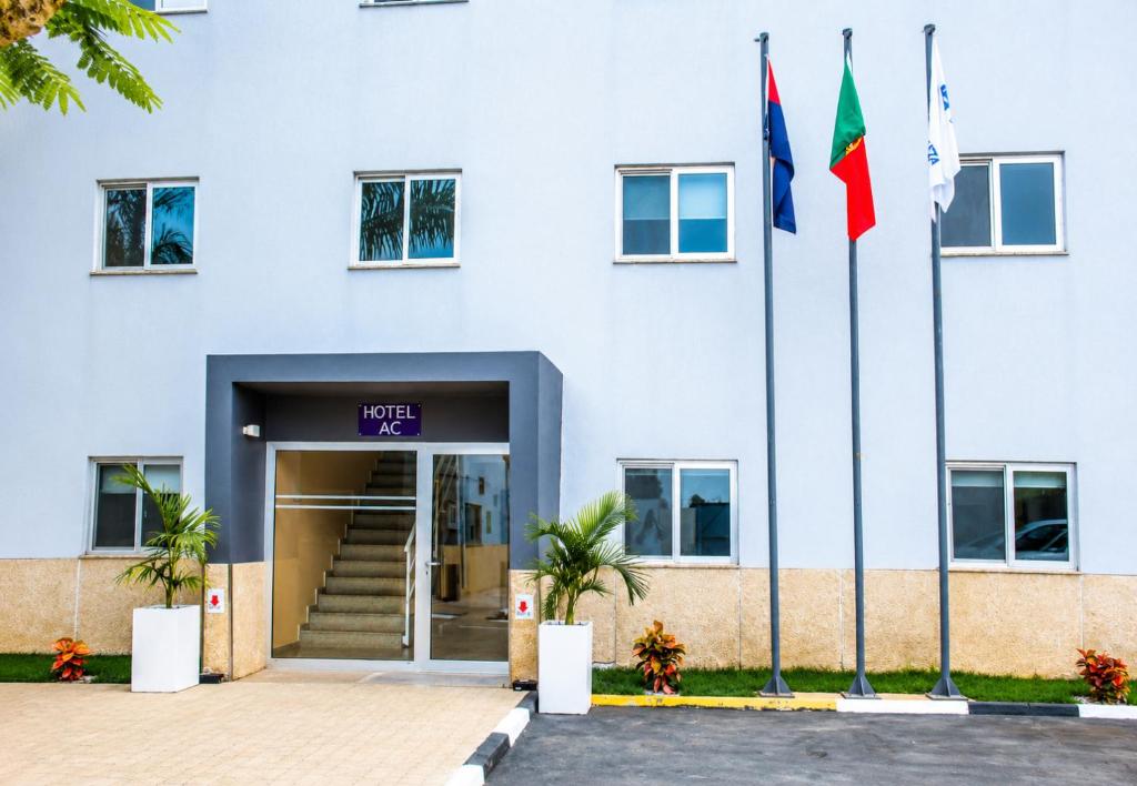 a building with two flags in front of it at AC Hotel in Luanda