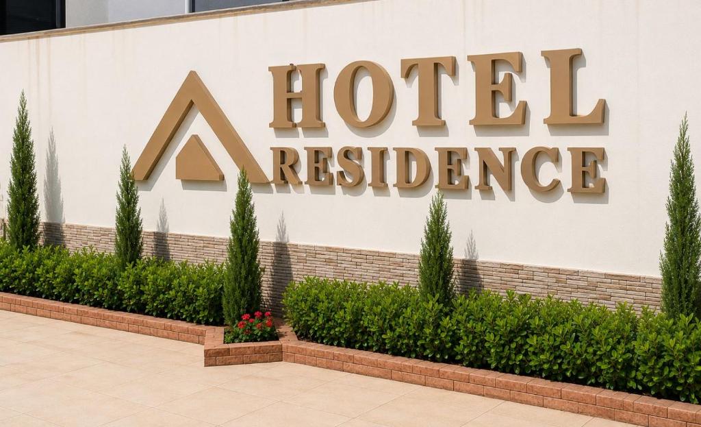 a sign for a hotel headquarters at Hotel Residence in Caruaru