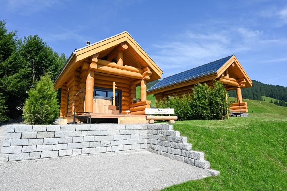 a log cabin with a bench in front of it at Mein Refugium Relax Tiny Haus in Unteriberg