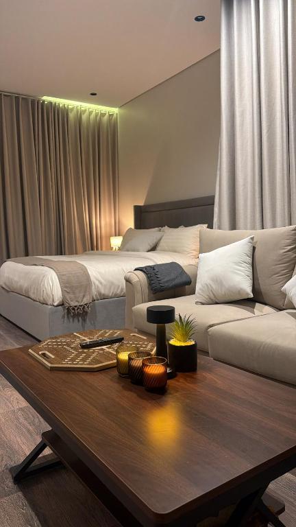 a living room with a couch and a coffee table at استديو in Al Khobar