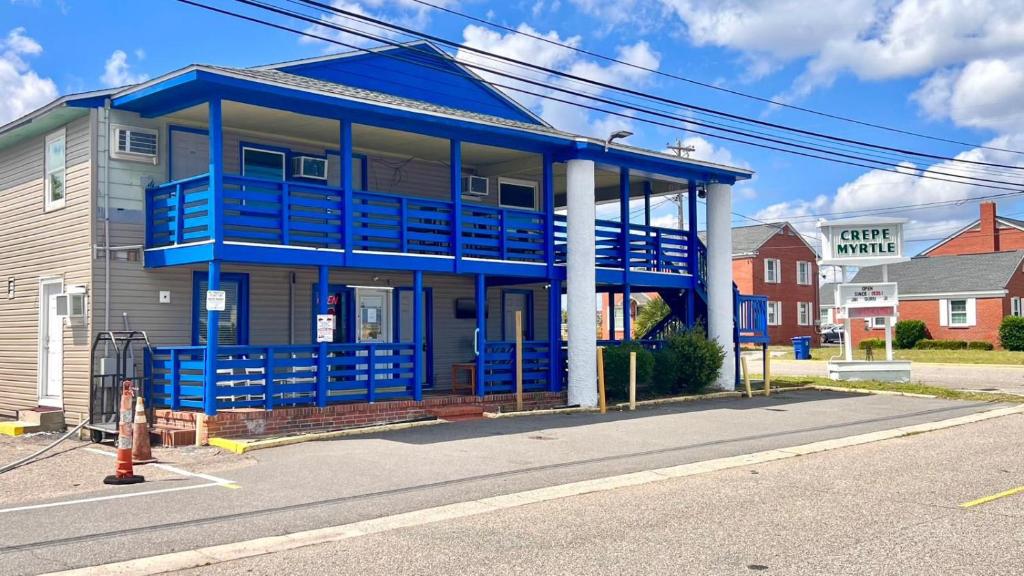 a blue house on the side of a street at CMI Hotel 1935 Myrtle Beach SC in Myrtle Beach