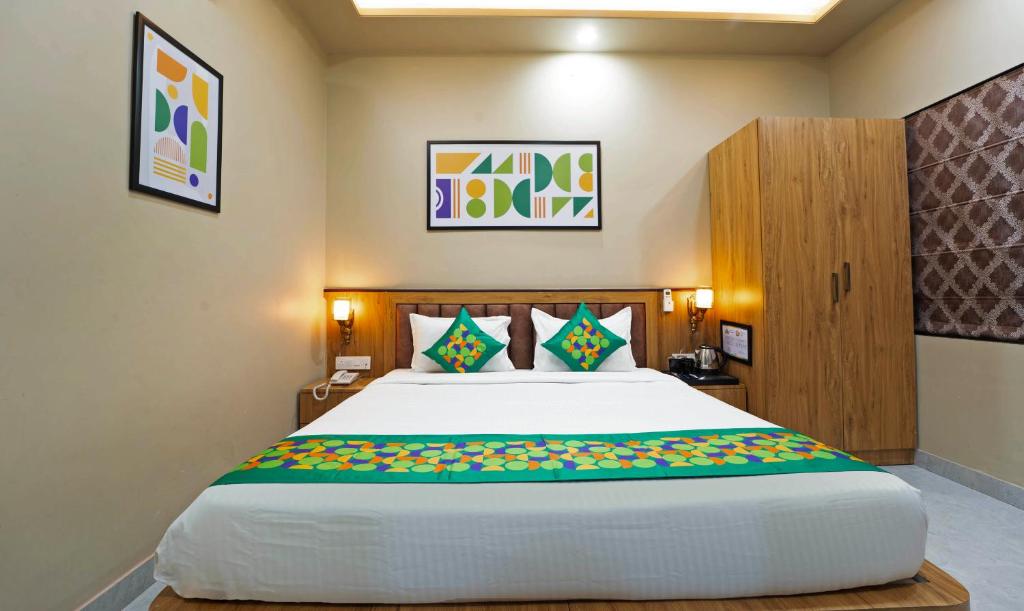 a bedroom with a large bed in a room at Anandam Hotel in Jaipur