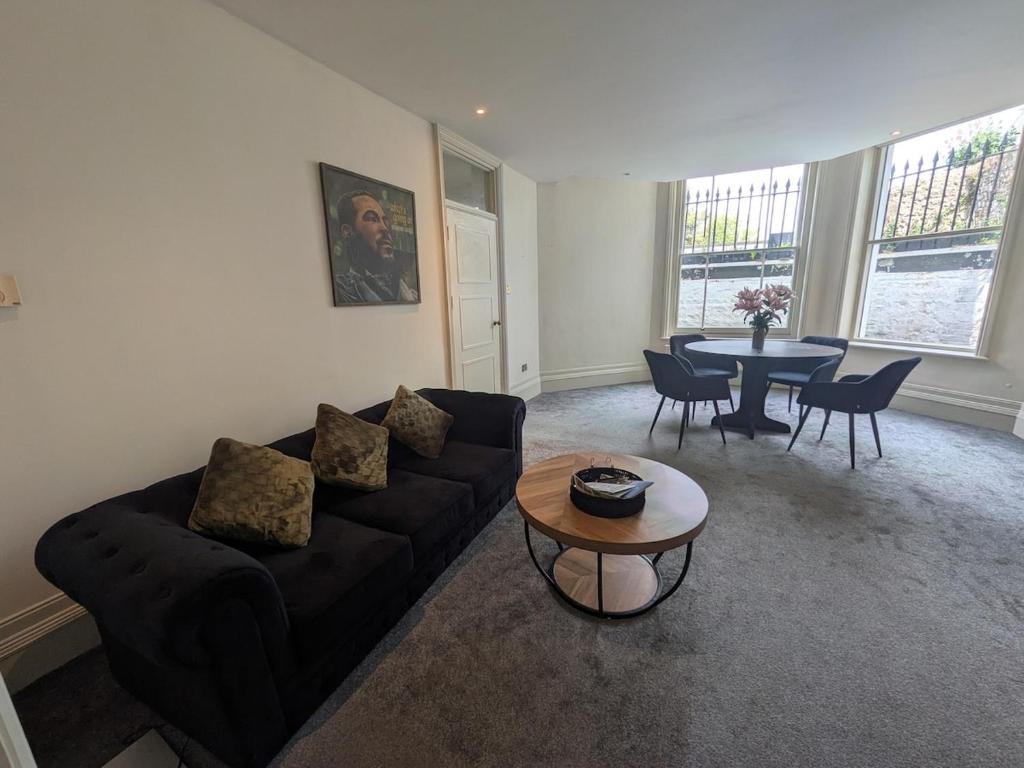 a living room with a couch and a table at Hidden get away in Lewes in Lewes