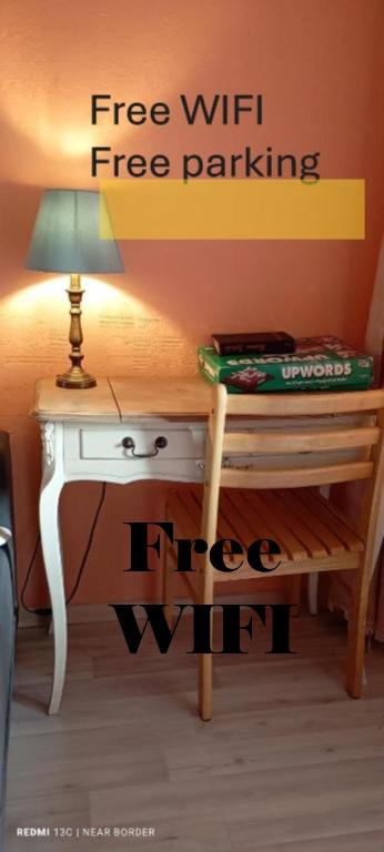 a desk with a lamp on top of it at Near border in Narva