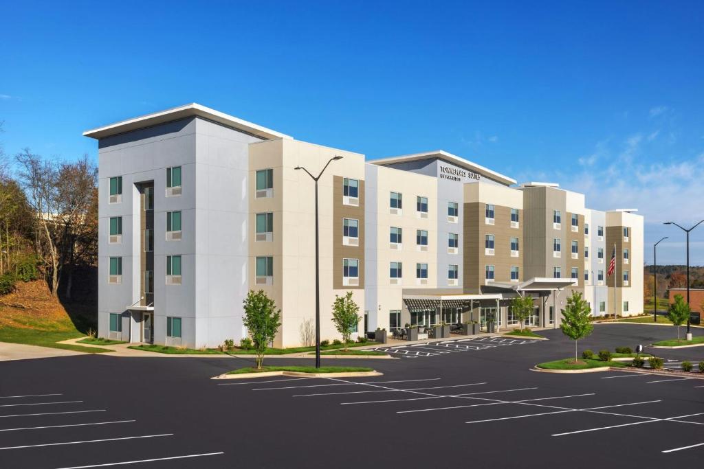 a rendering of a hotel with a parking lot at TownePlace Suites by Marriott Hickory in Hickory