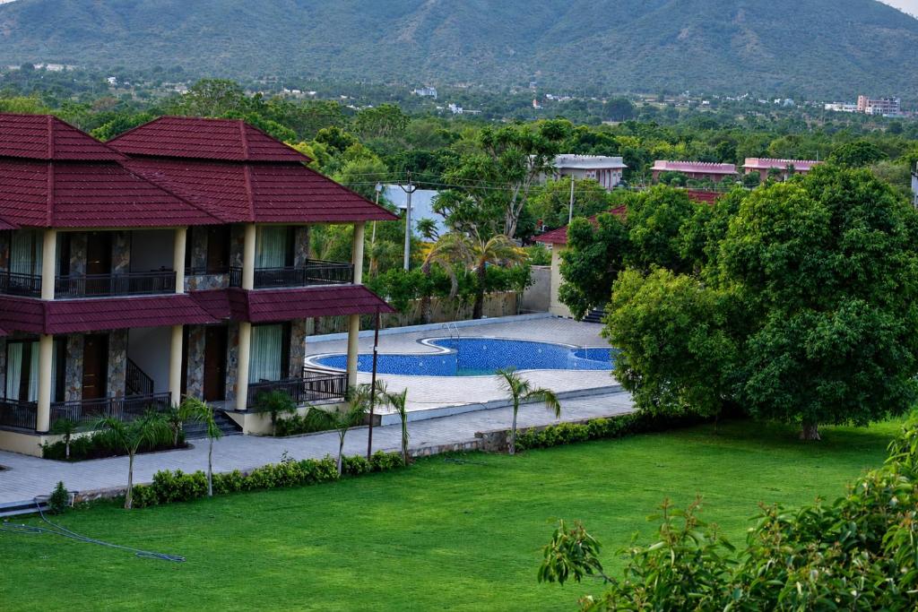 an aerial view of a house with a swimming pool at Vijay Vilas by Arow Hotels and Resorts in Pushkar