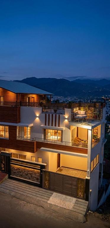 a large building at night with its lights on at Ranim Family Lodge - Abbottabad in Abbottabad