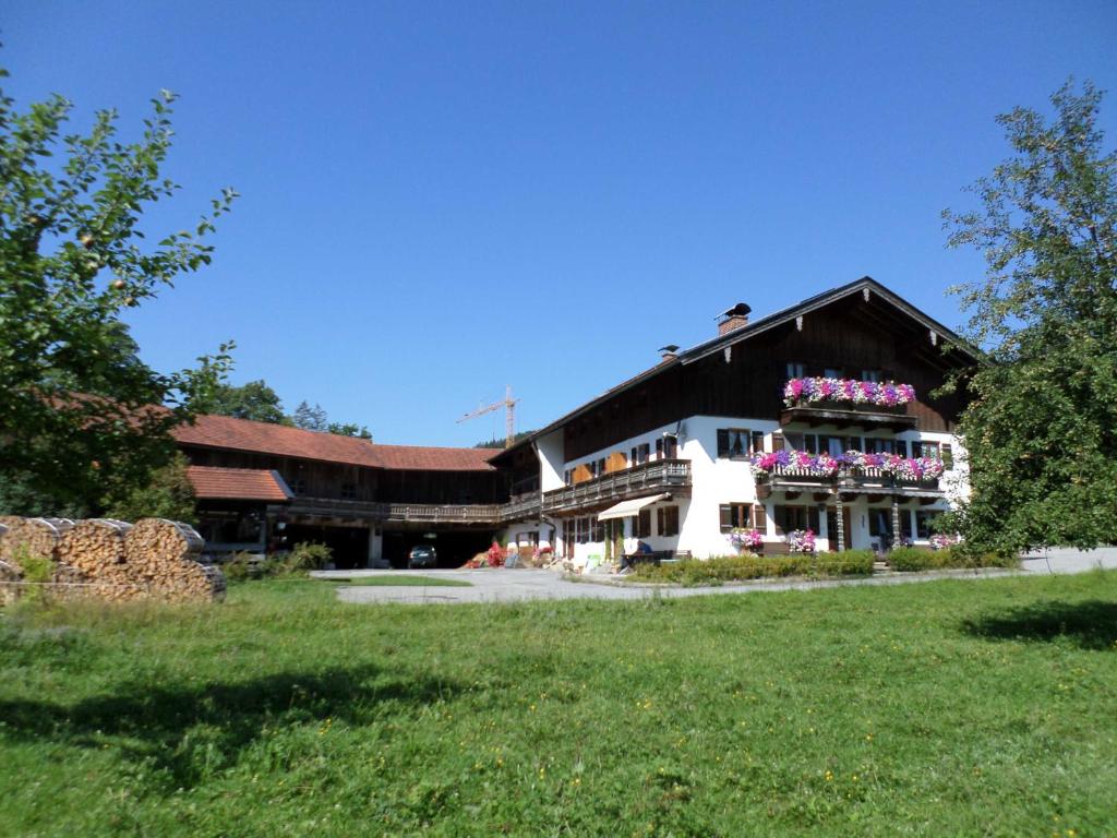 a building with flower boxes on the side of it at Haus Bamberger in Fischbachau