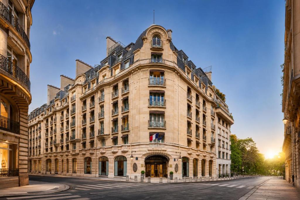 a large stone building on a street at Sofitel Paris Arc De Triomphe in Paris