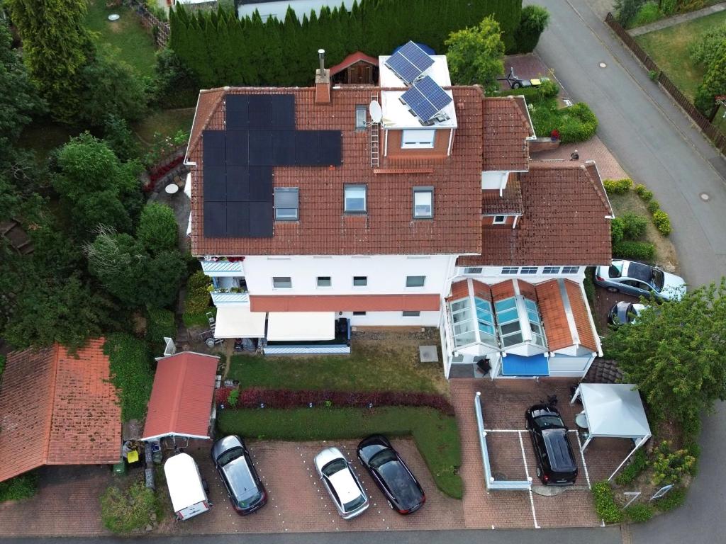 an overhead view of a house with cars parked on the yard at Ferienwohnung Haus Krüger in Hemfurth-Edersee