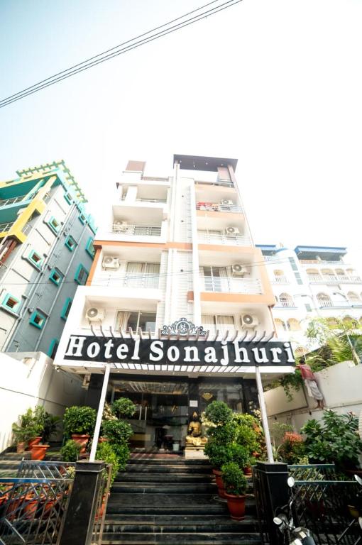 a building with a hotel sign and stairs in front at Hotel Sonajhuri in New Digha