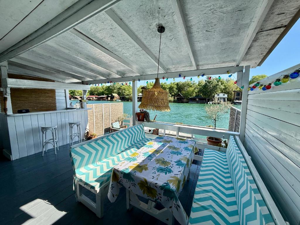 a patio with a table and a view of the water at Ada Gioia in Ulcinj