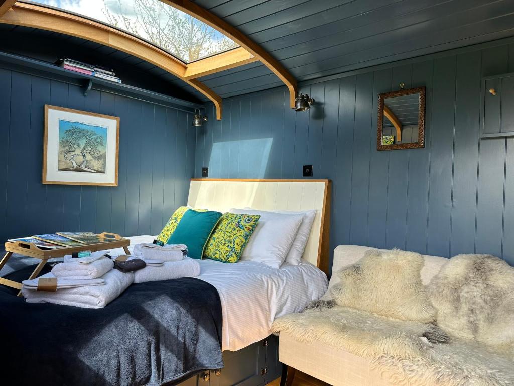 a bedroom with a bed and a skylight at Da Vinci's Den in North Tawton