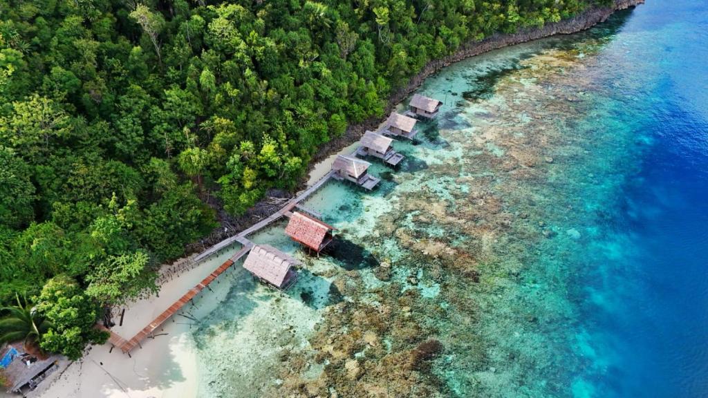 an aerial view of a resort on a beach at Gloria Dive Homestay in Keruo