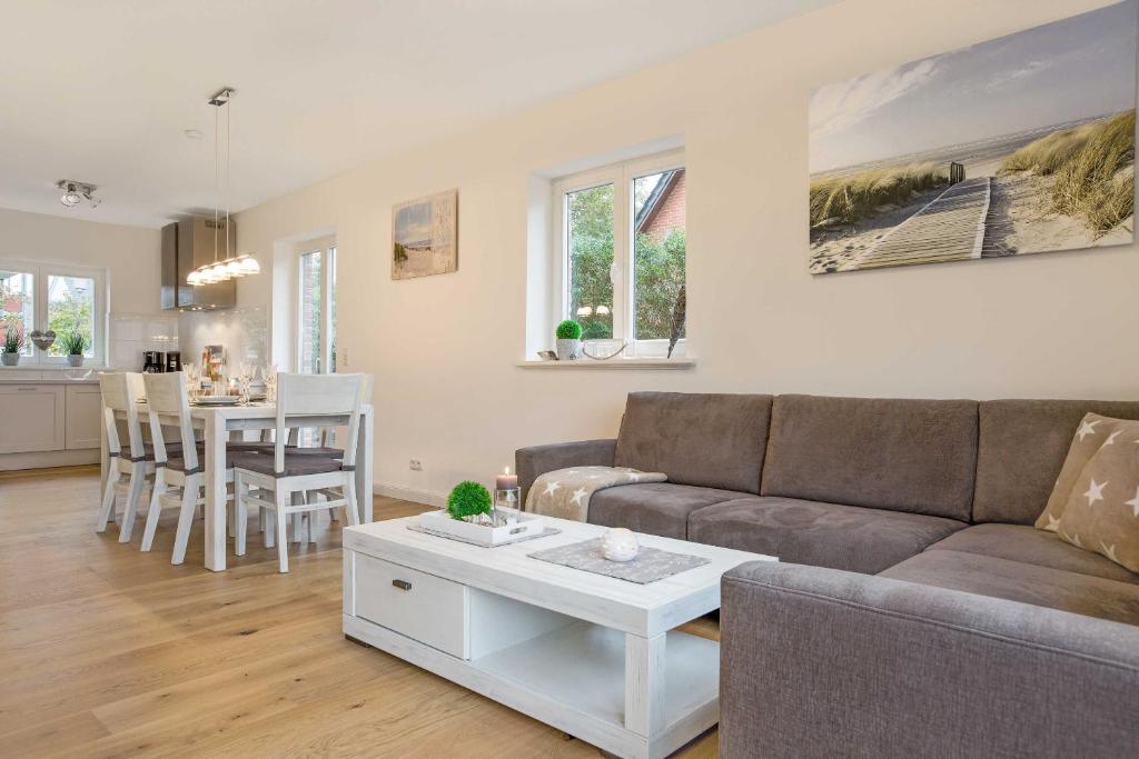 a living room with a couch and a table at Fennenblick in List
