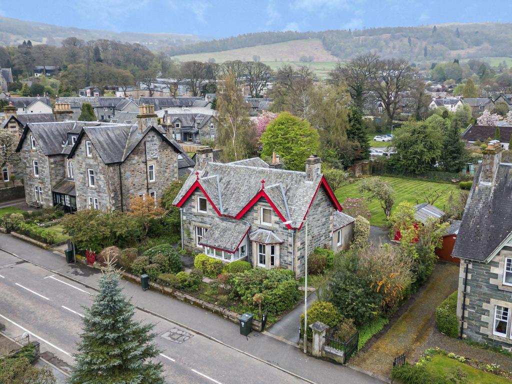 a group of houses in a town with a street at Edengrove in Aberfeldy