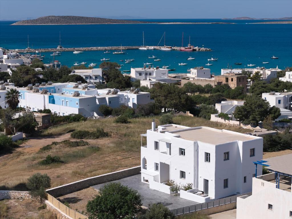 an aerial view of a white house and the ocean at Mouragio Stay - Aliki , Paros in Aliki